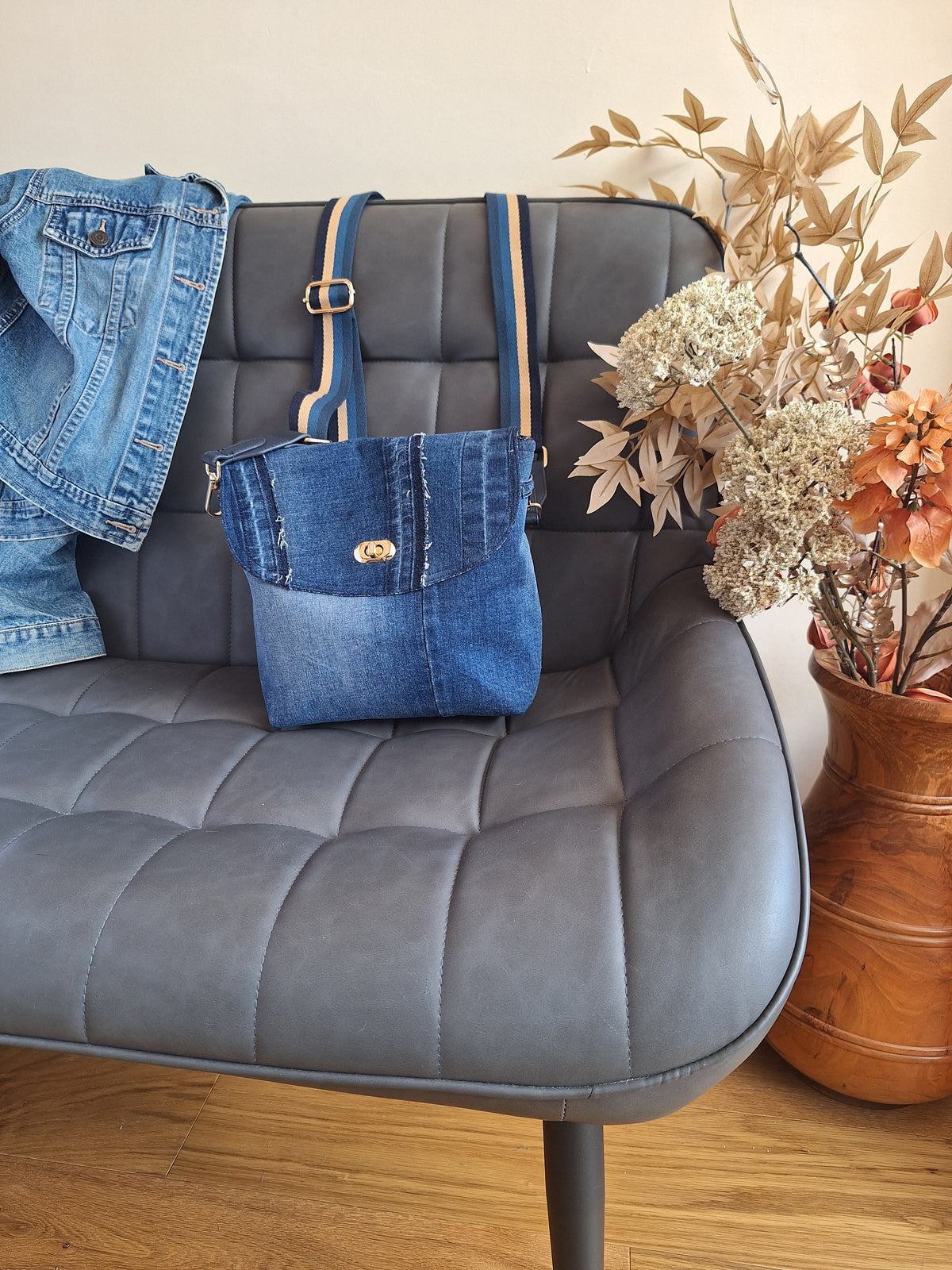 Denim crossbody bag with striped strap