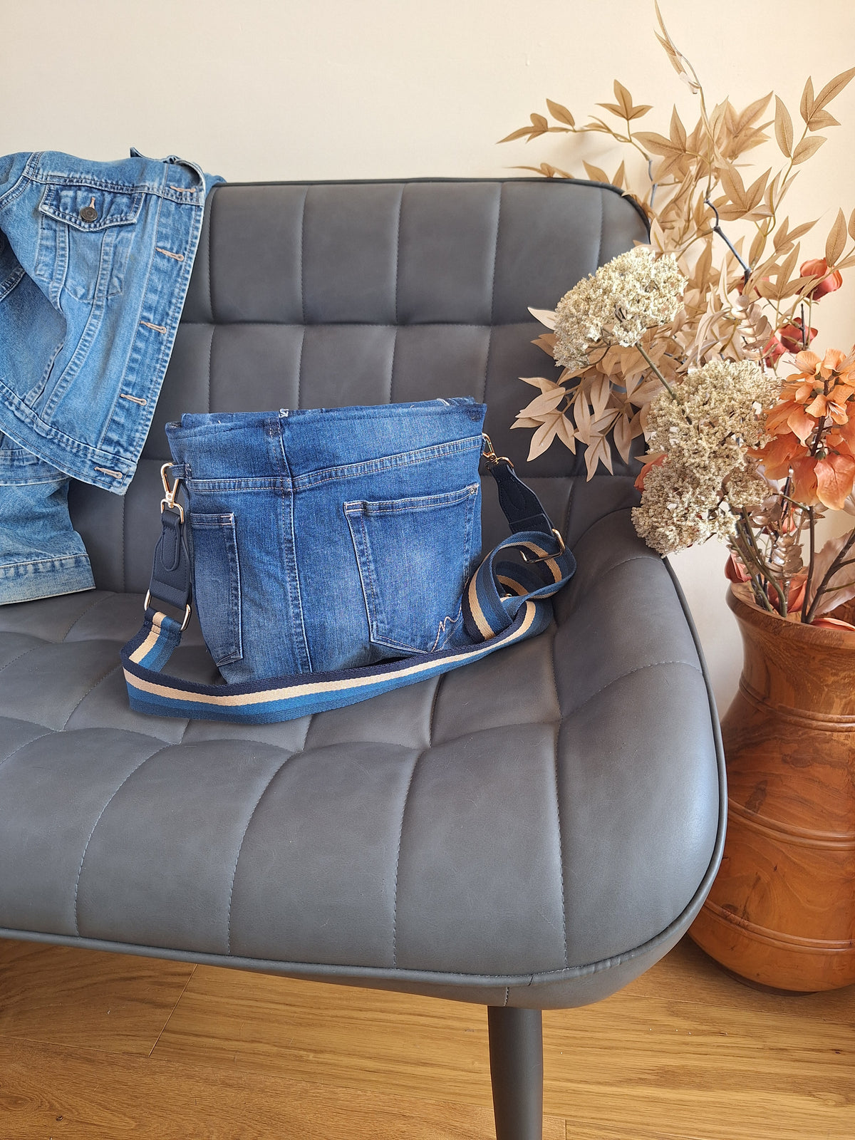 Denim crossbody bag with striped strap