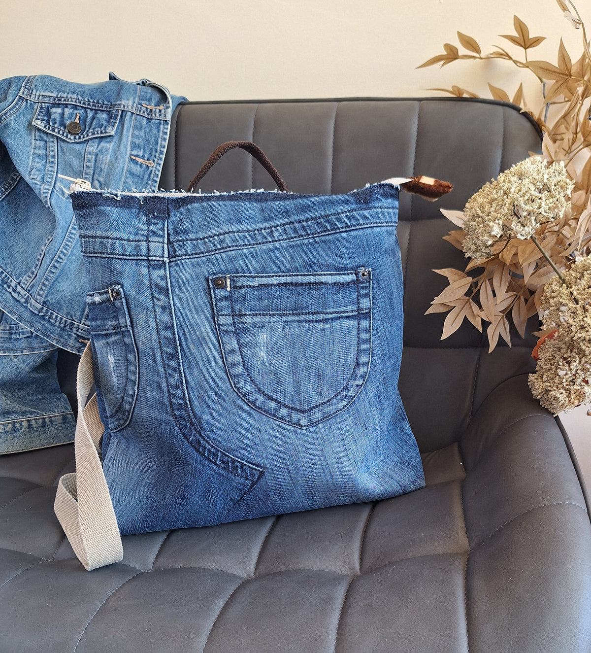 The Backpack: blue denim with giraffe print lining