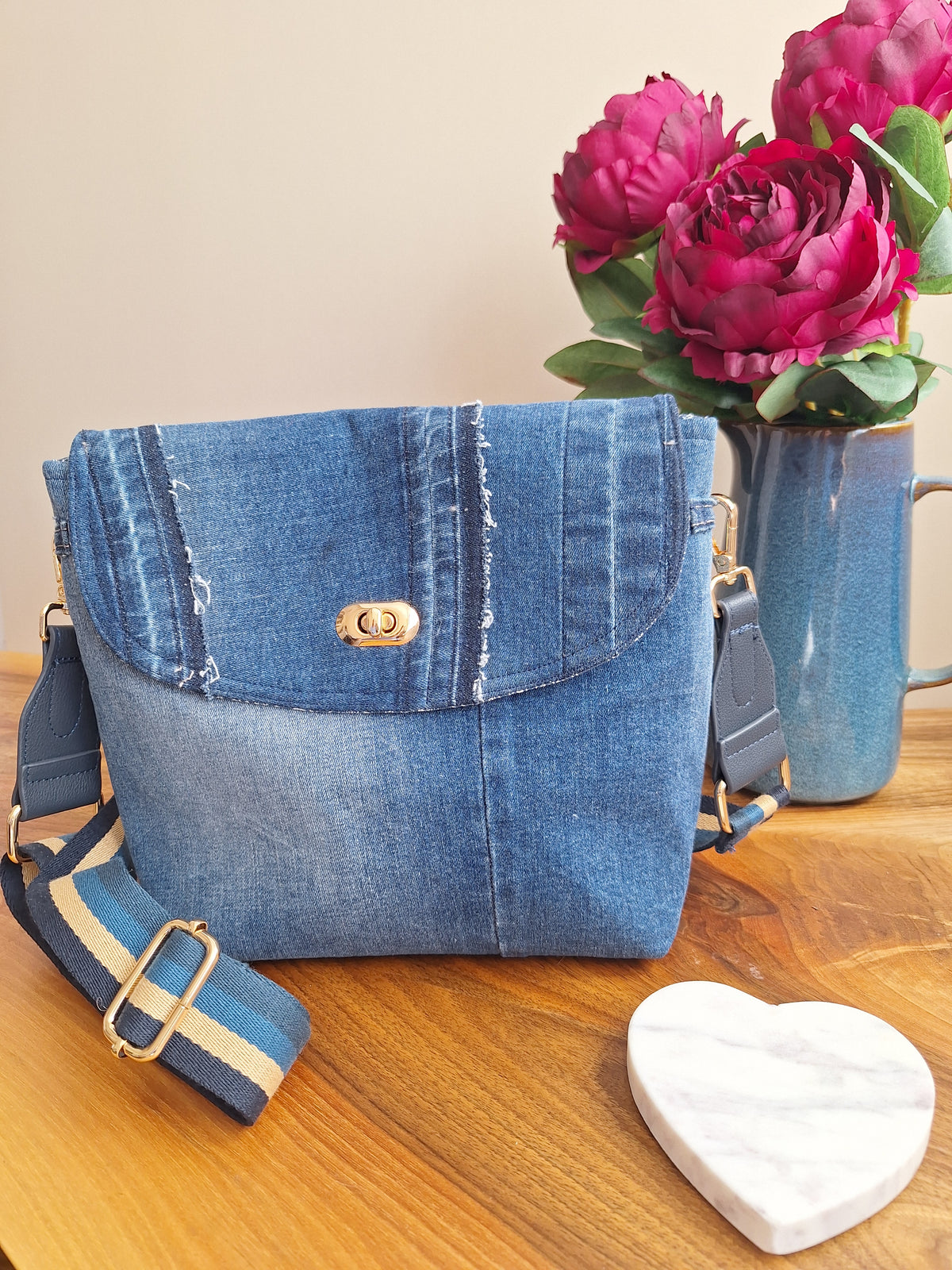 Denim crossbody bag with striped strap
