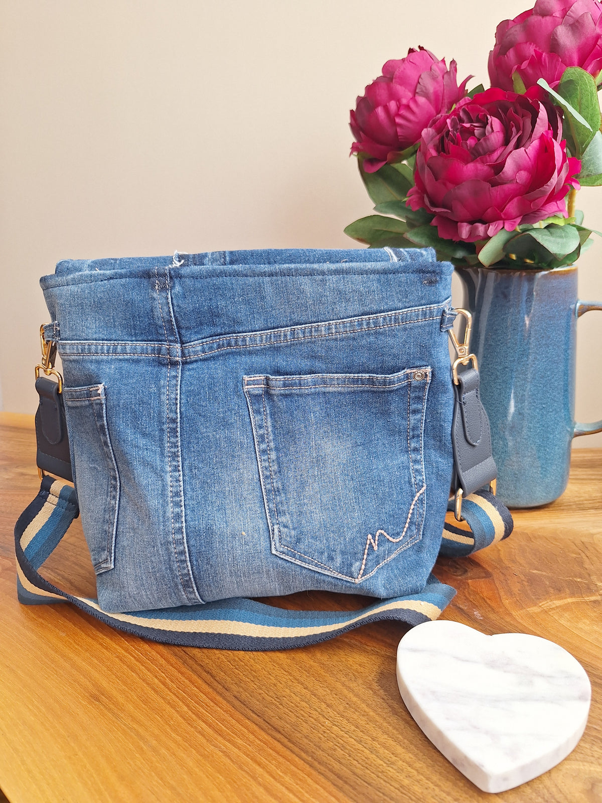 Denim crossbody bag with striped strap
