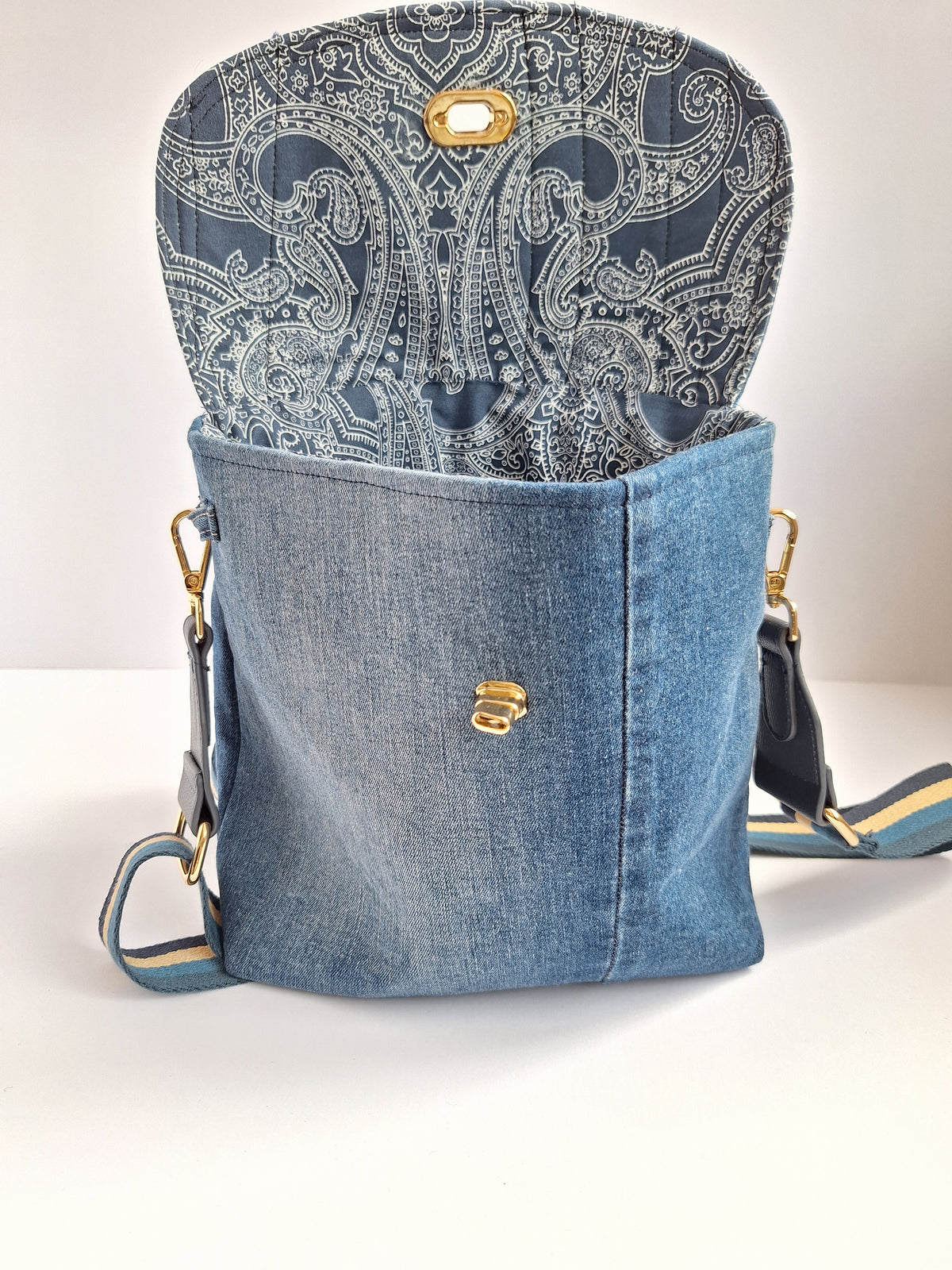 Denim crossbody bag with striped strap