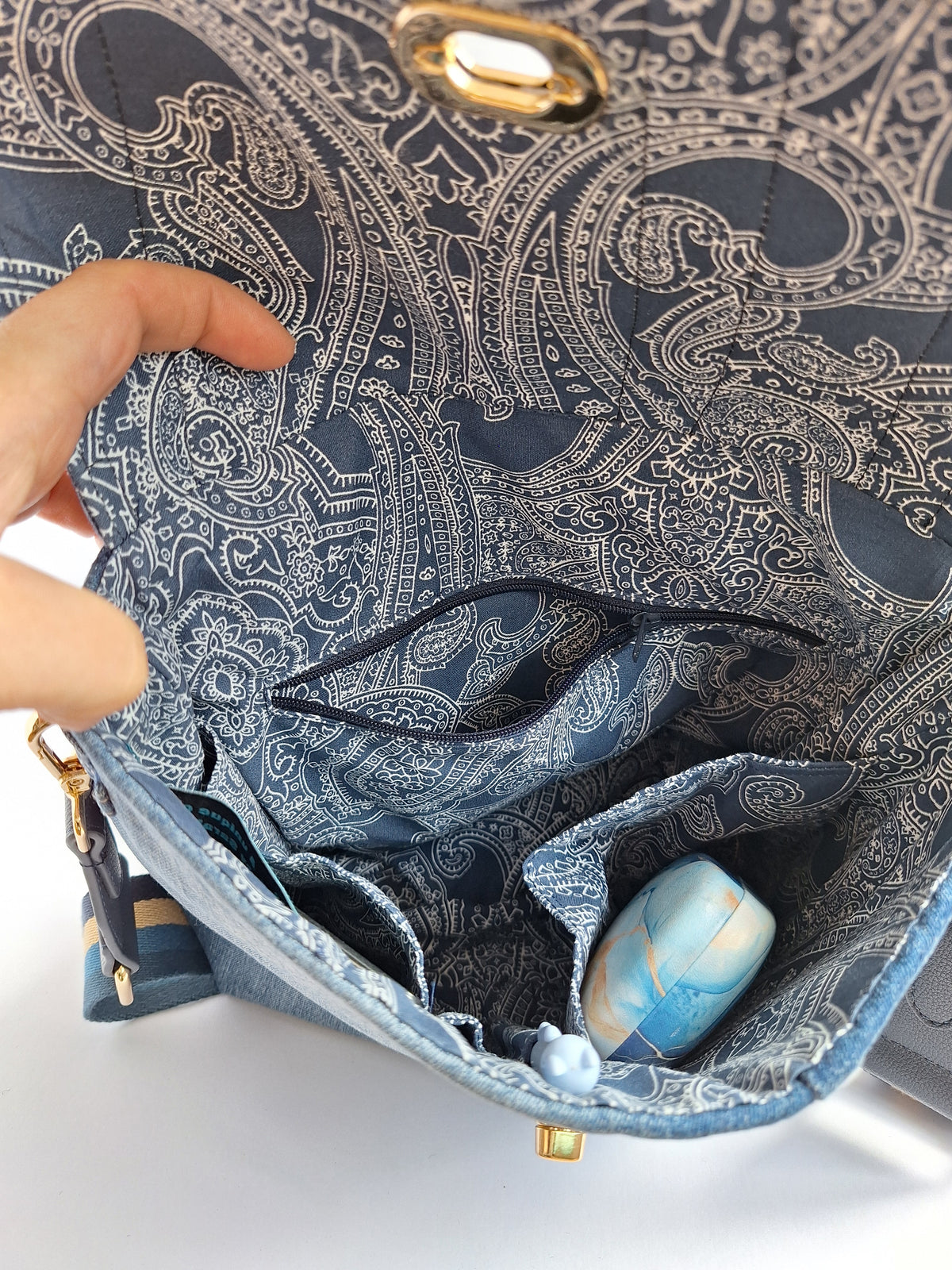 Denim crossbody bag with striped strap