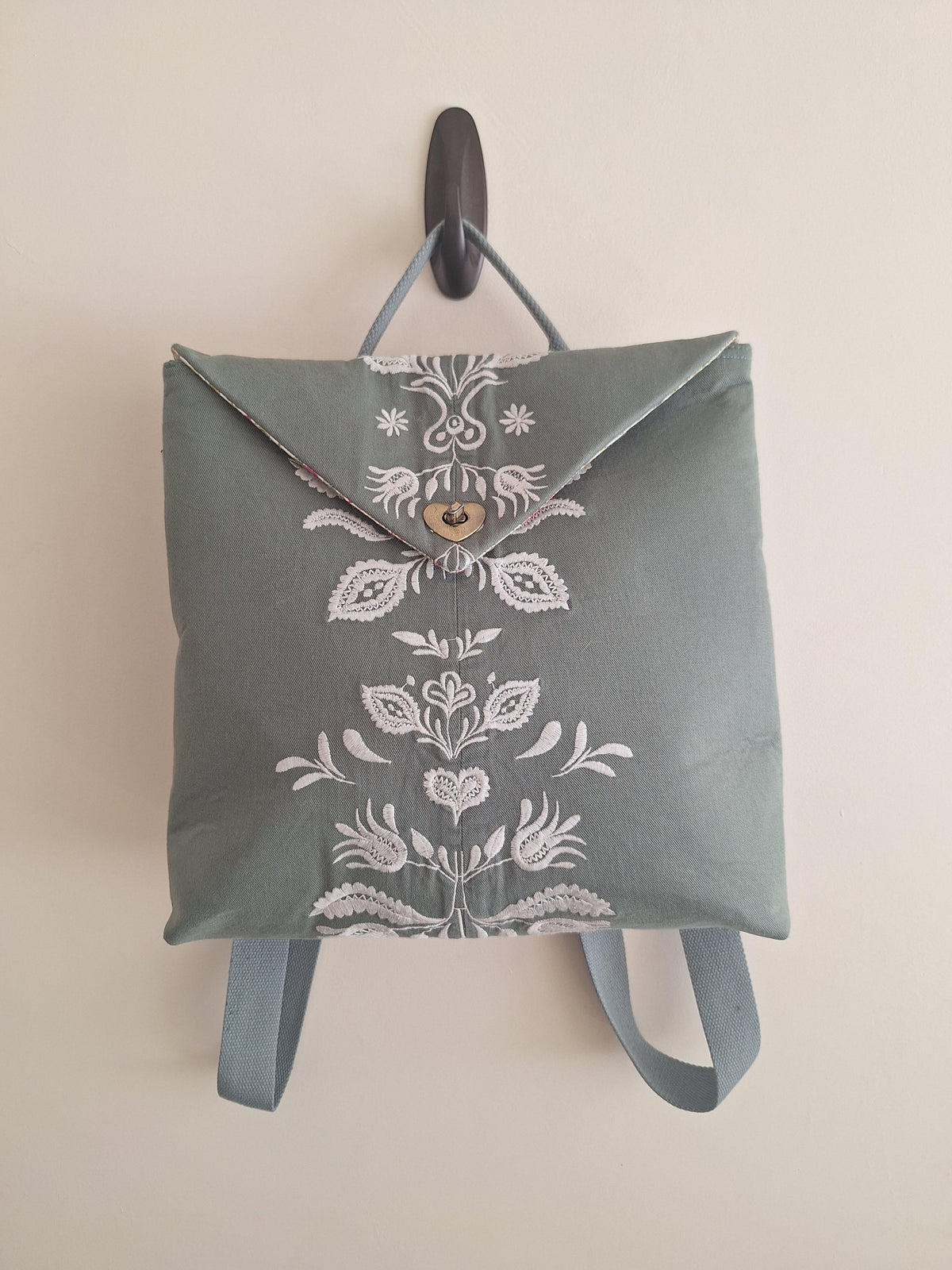 The Backpack: olive green with embroidered detail