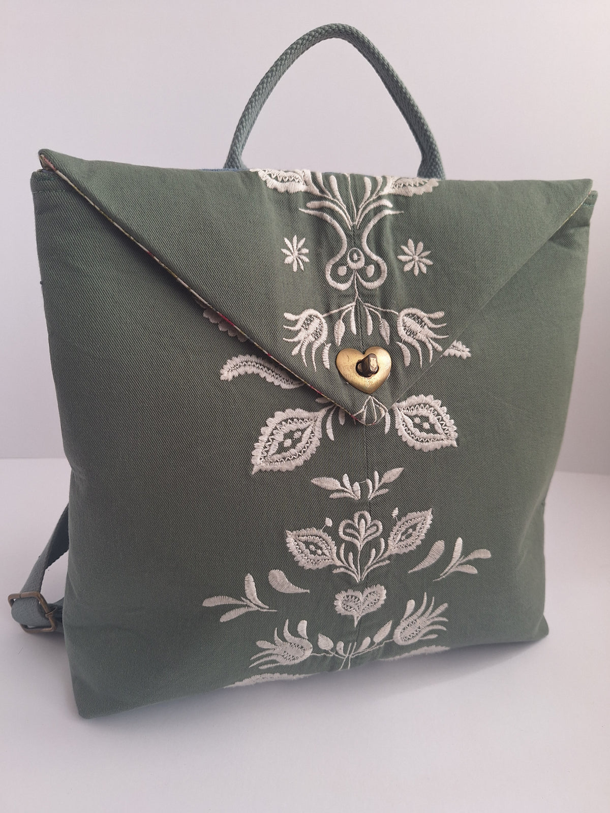 The Backpack: olive green with embroidered detail