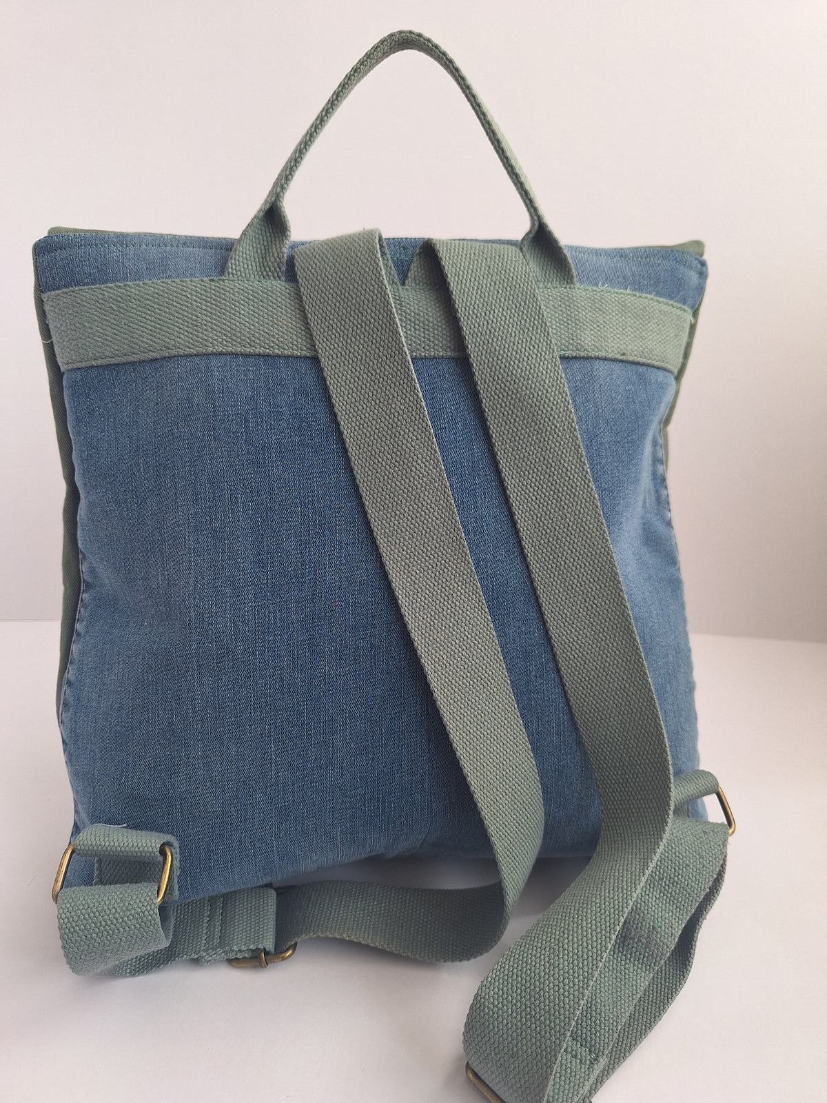 The Backpack: olive green with embroidered detail