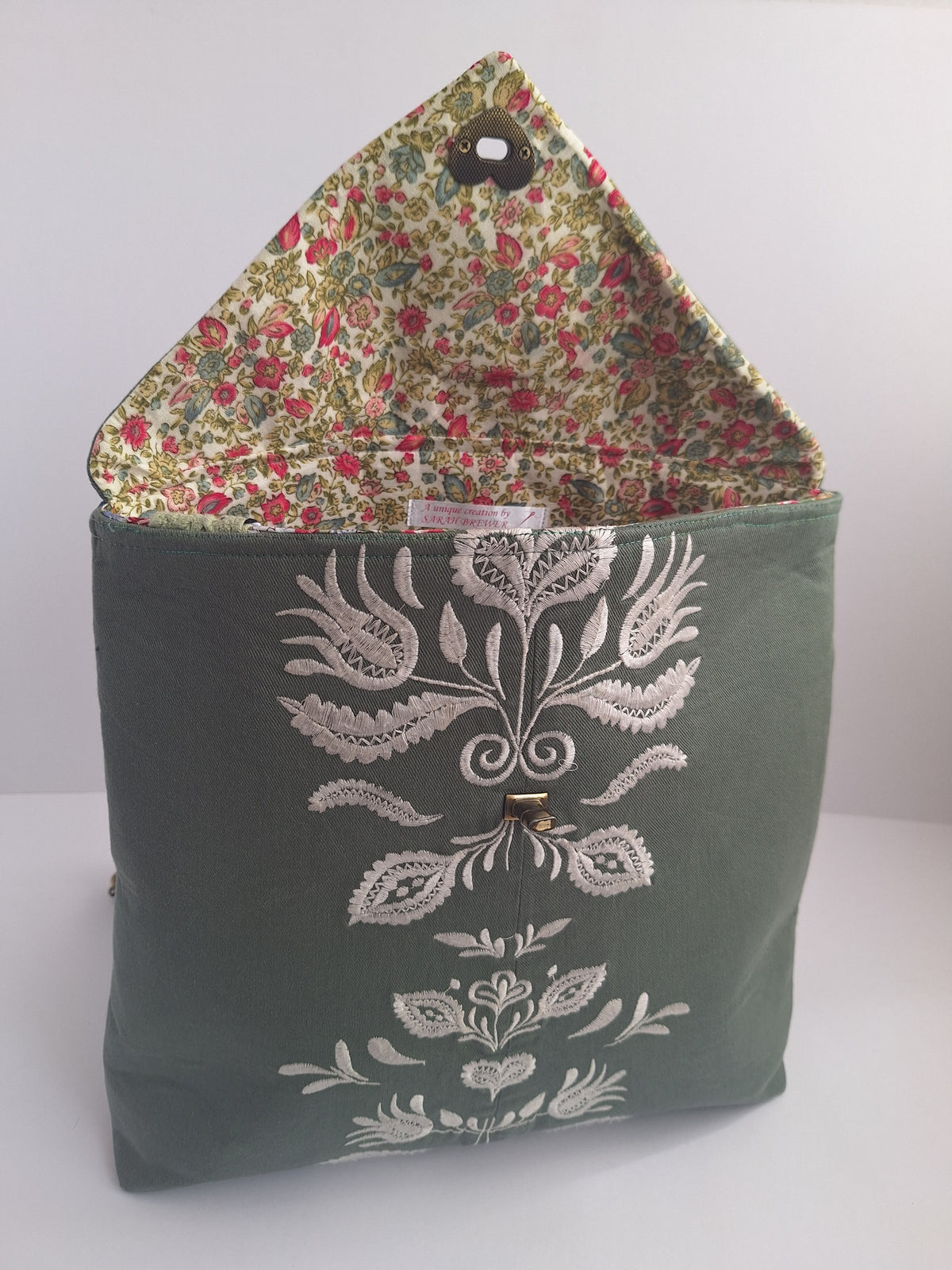 The Backpack: olive green with embroidered detail