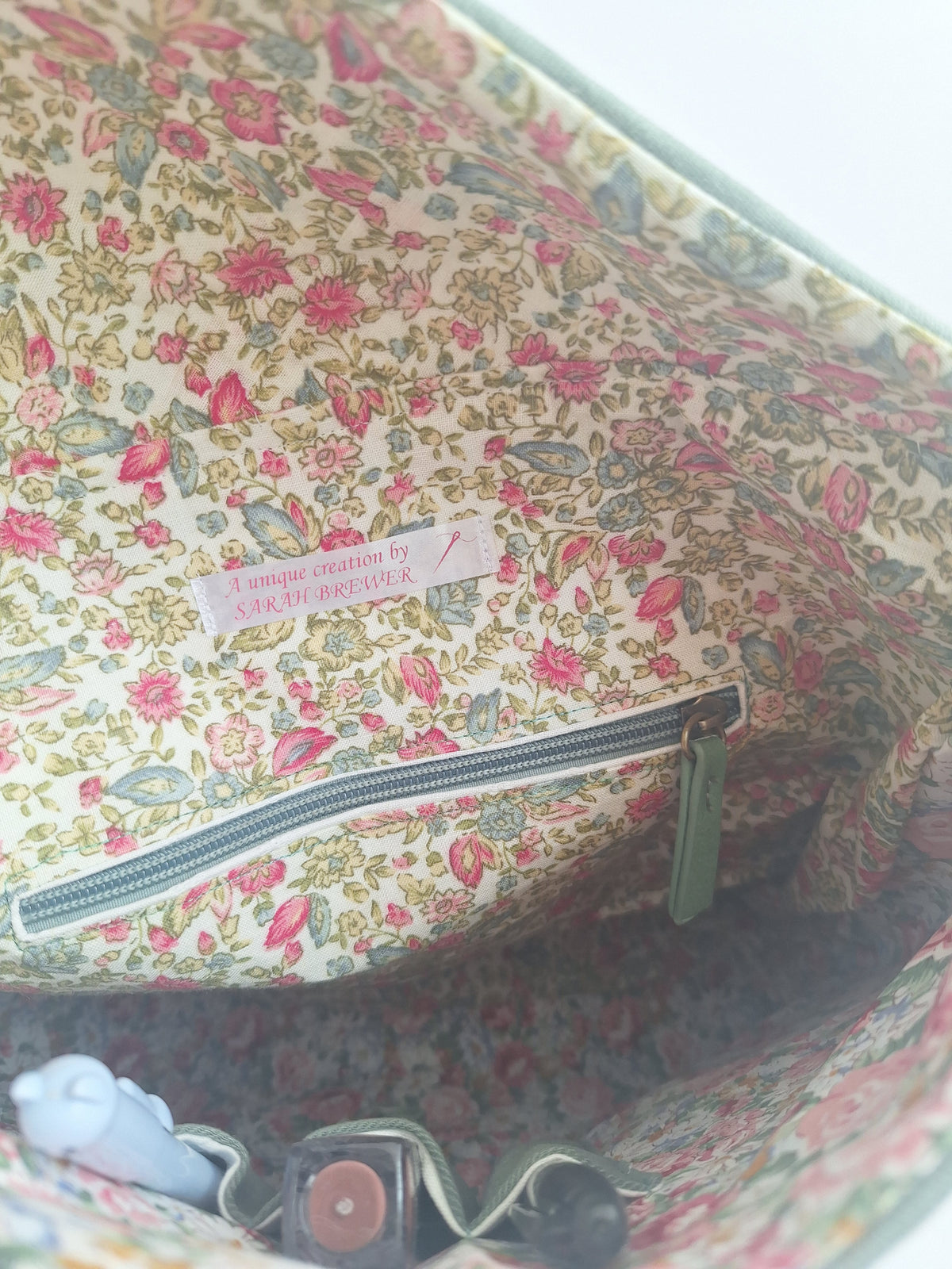 The Backpack: olive green with embroidered detail