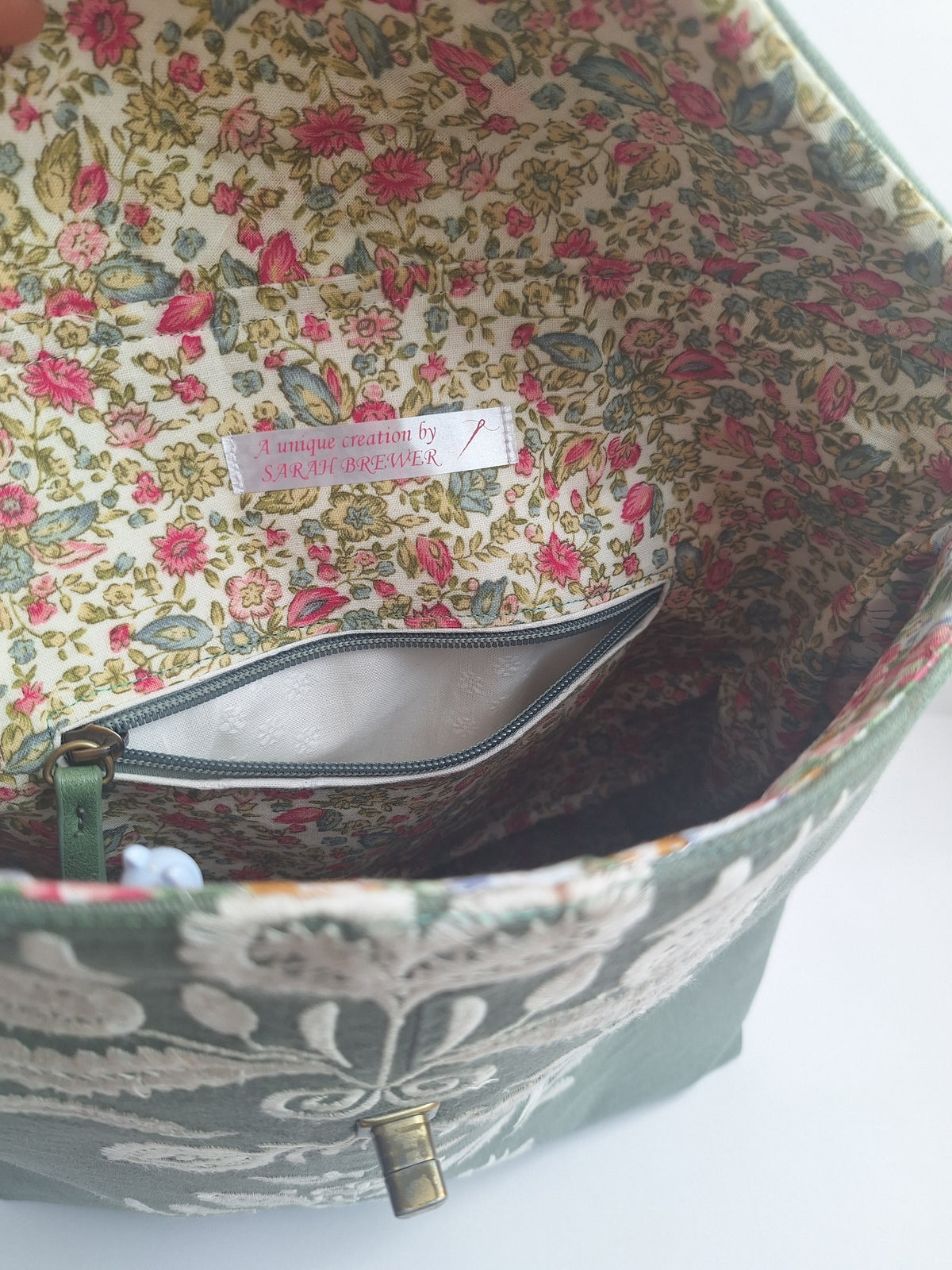 The Backpack: olive green with embroidered detail