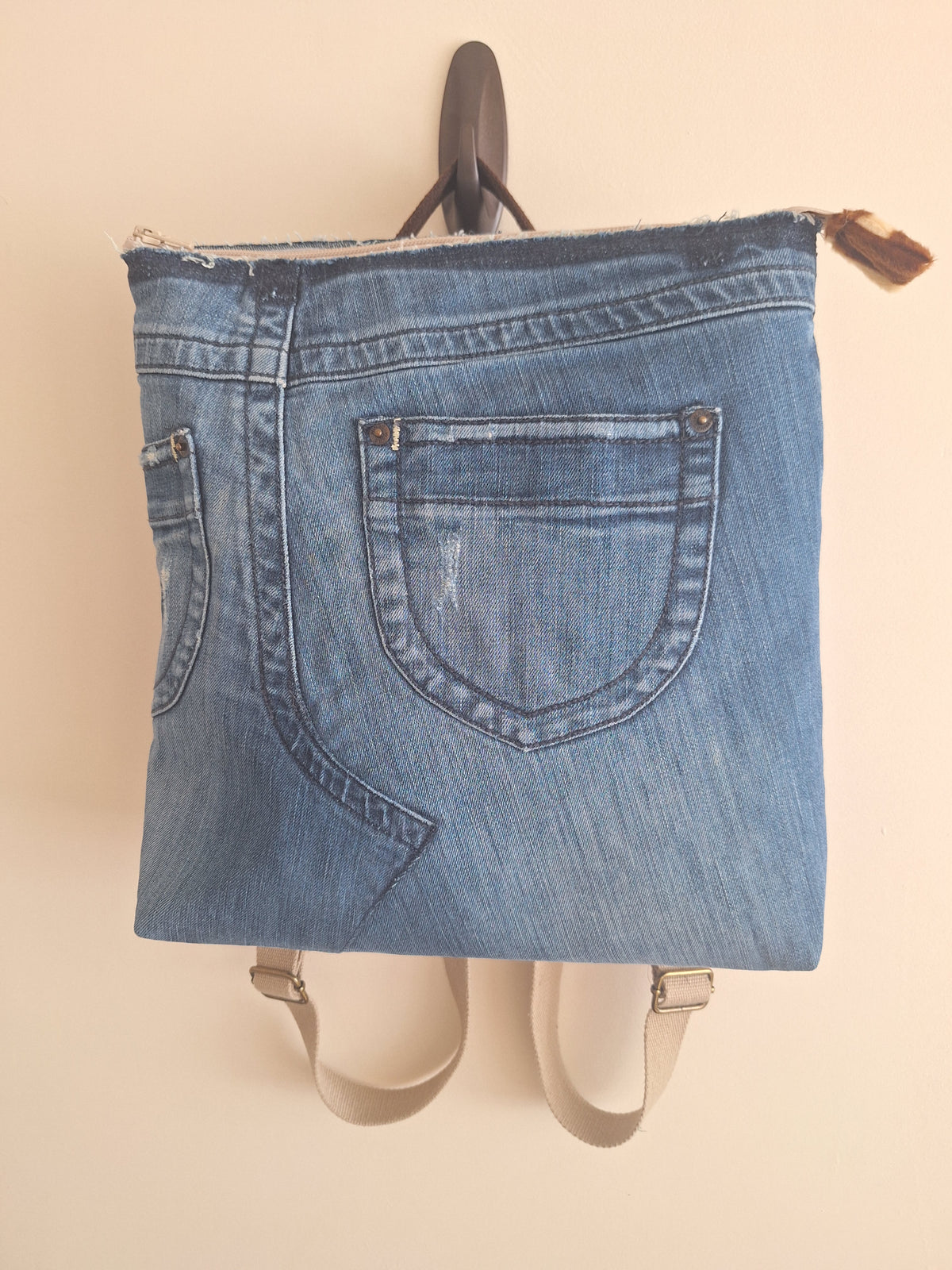 The Backpack: blue denim with giraffe print lining