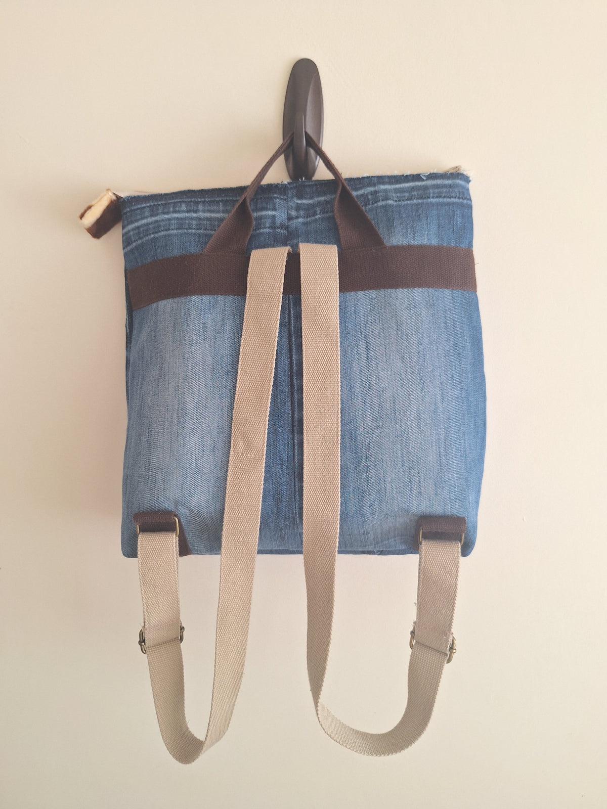 The Backpack: blue denim with giraffe print lining