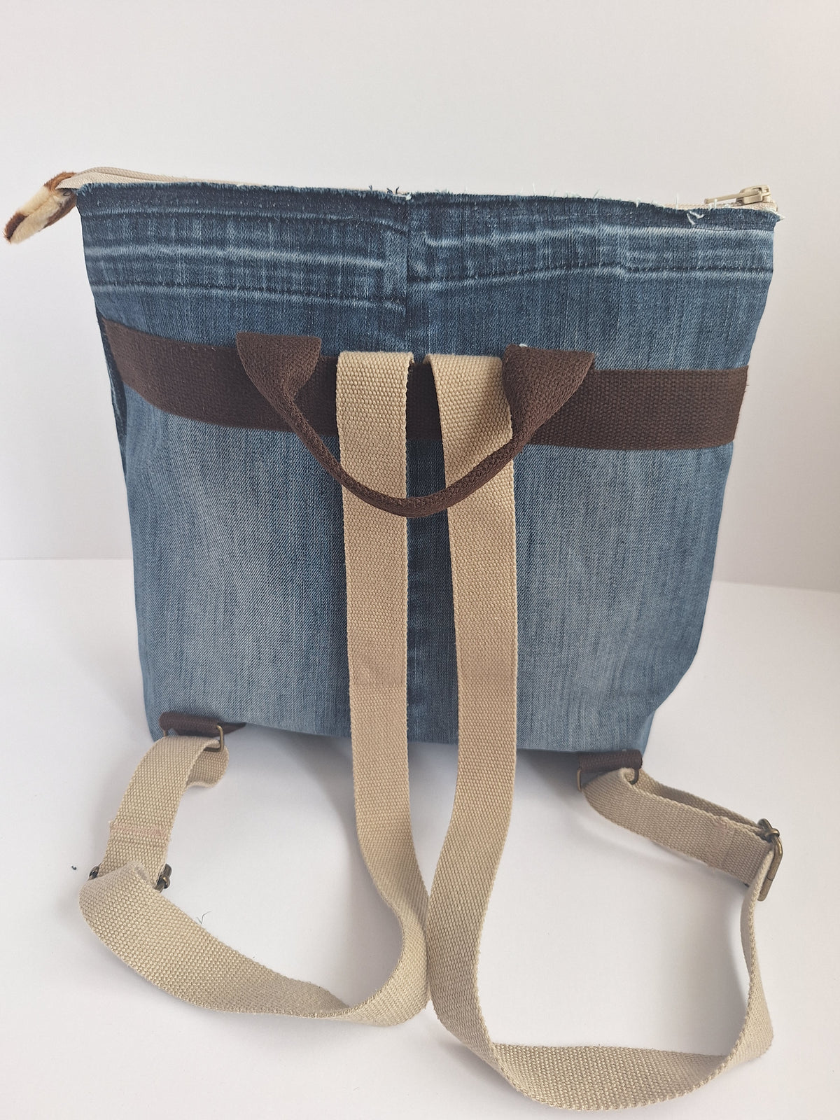 The Backpack: blue denim with giraffe print lining