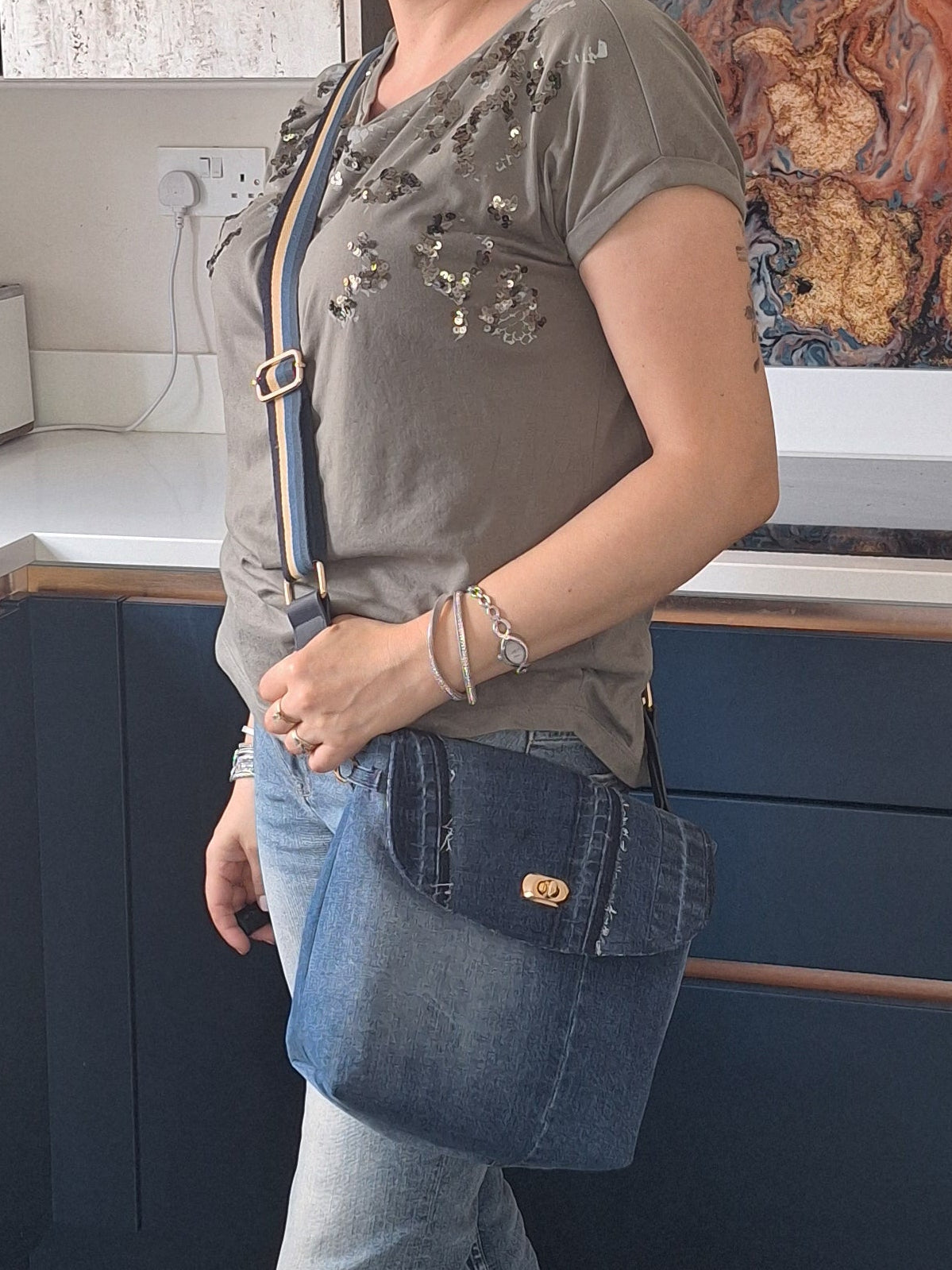 Denim crossbody bag with striped strap