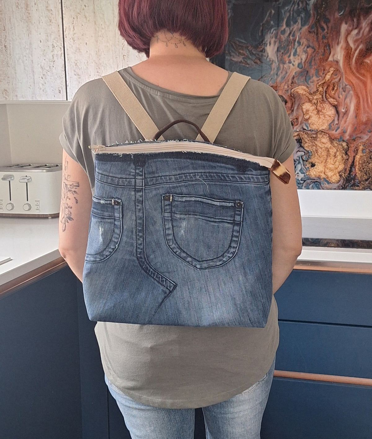 The Backpack: blue denim with giraffe print lining